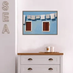 23" X 16" Hanging Laundry Along Wall By Brenda Tharp Danita Delimont Framed Canvas Wall Art Blue - Amanti Art -Amanti Art GUEST 2a0d352a ce16 4201 9784 af79565c3079