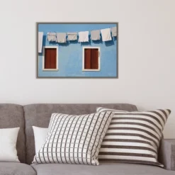 23" X 16" Hanging Laundry Along Wall By Brenda Tharp Danita Delimont Framed Canvas Wall Art Blue - Amanti Art -Amanti Art GUEST 641a5143 6445 4421 99af 7eae912e9794