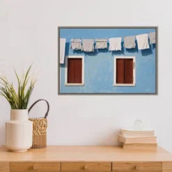 23" X 16" Hanging Laundry Along Wall By Brenda Tharp Danita Delimont Framed Canvas Wall Art Blue - Amanti Art -Amanti Art GUEST b20649a9 7fba 4d02 af4d d13fe3f2b1de
